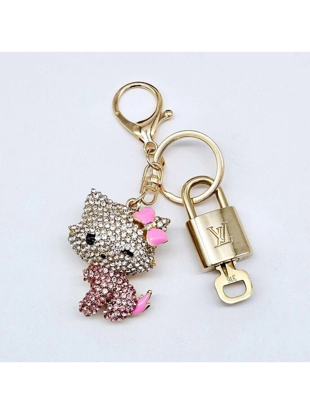 Authentic Louis Vuitton Lock & Key with unbranded Hello Kitty Bagcharm, Keycharm